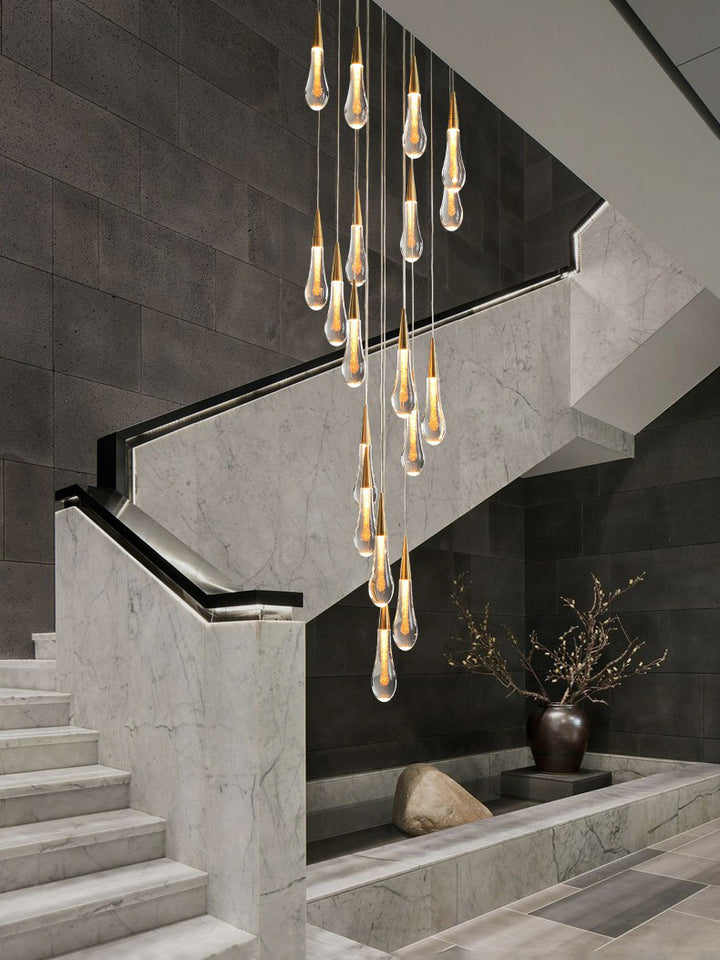 Modern staircase chandelier in gold finish